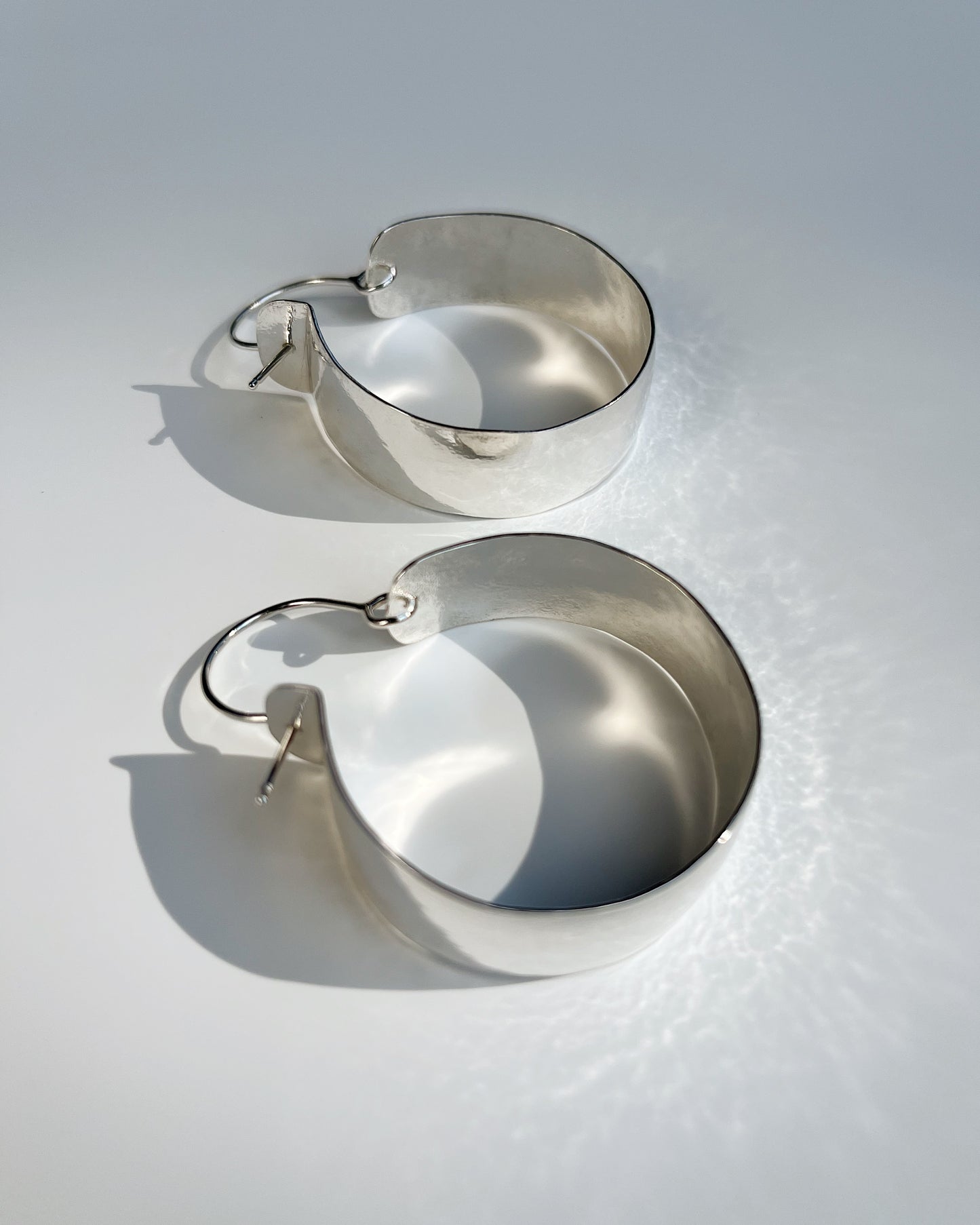 As hoop earrings